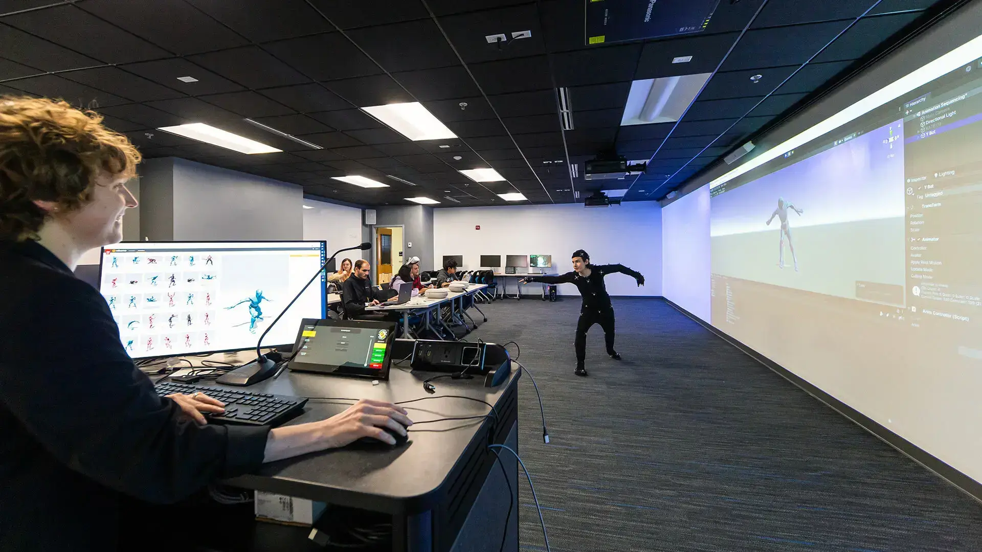 Andrei Davydov '25, a studio art and immersive media design double major, demonstrates how to use a motion capture suit