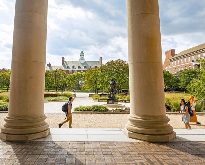 students walking among columns