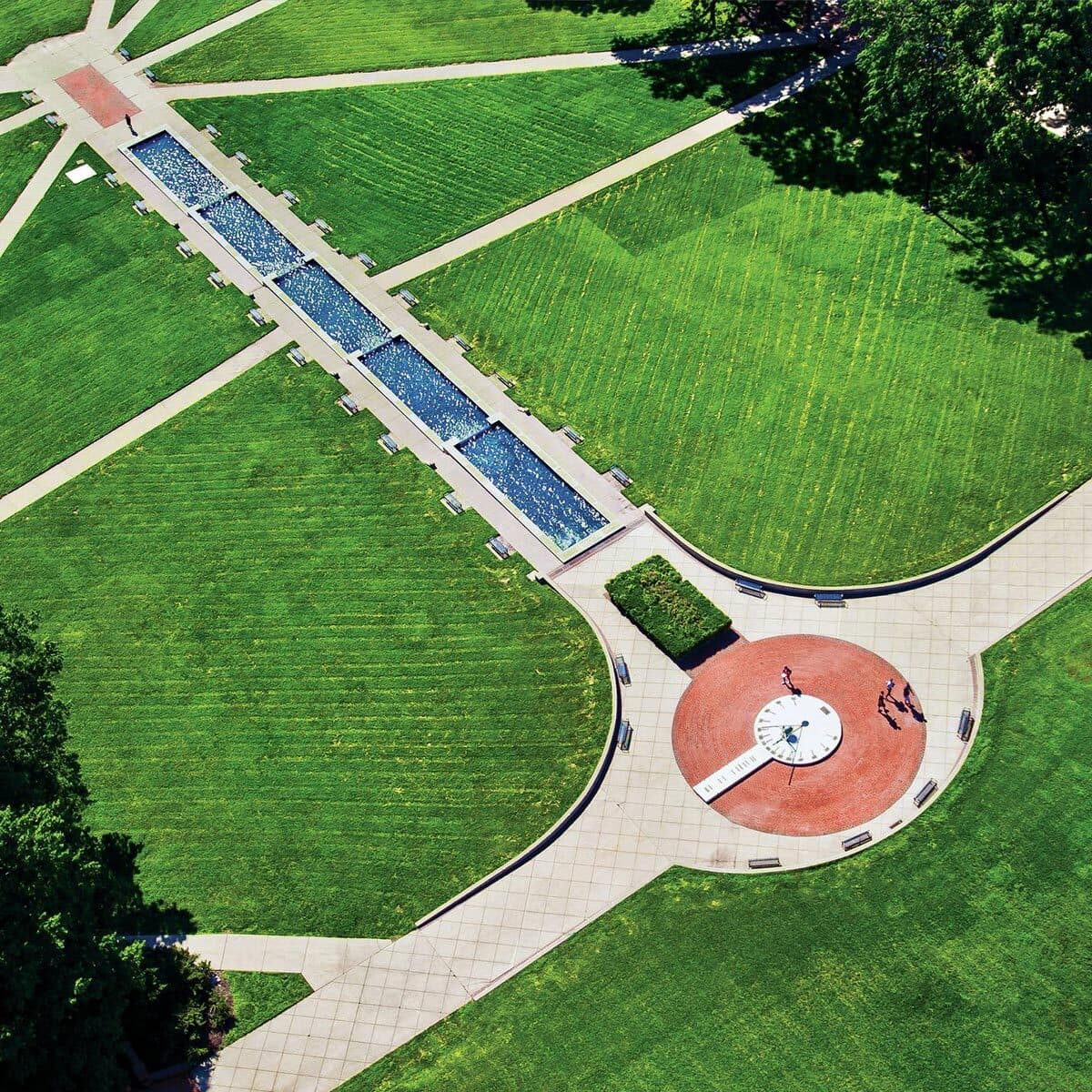 Birds eye view looking down onto a clean blue ODK Fountain, and the campus Sundial at the center of McKeldin Mall.